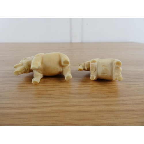 355 - Two antique hand carved bone elephants.