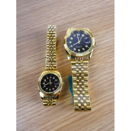 358 - A Dedima ladies and gents wrist watch set.