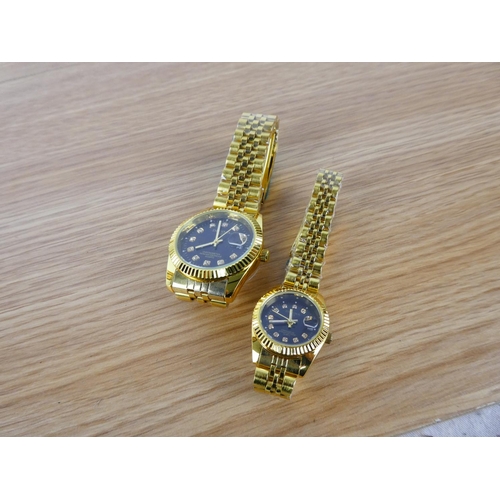 358 - A Dedima ladies and gents wrist watch set.