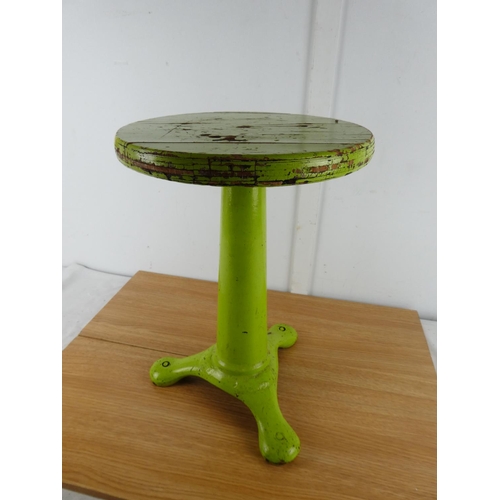 379 - A stunning antique factory stool on a cast iron base.