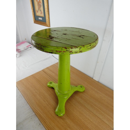 379 - A stunning antique factory stool on a cast iron base.