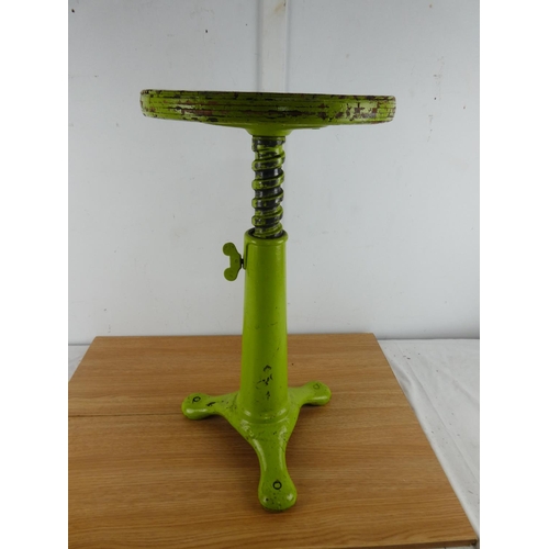 379 - A stunning antique factory stool on a cast iron base.