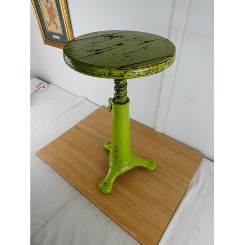 379 - A stunning antique factory stool on a cast iron base.