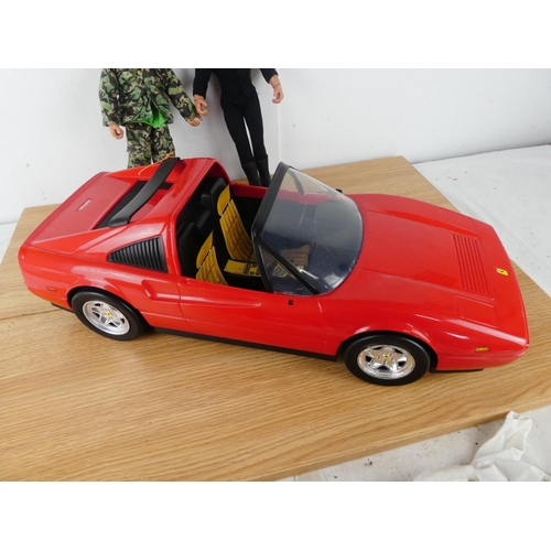 387 - A Ferrari toy car and Action Man figure and more.