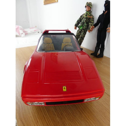 387 - A Ferrari toy car and Action Man figure and more.