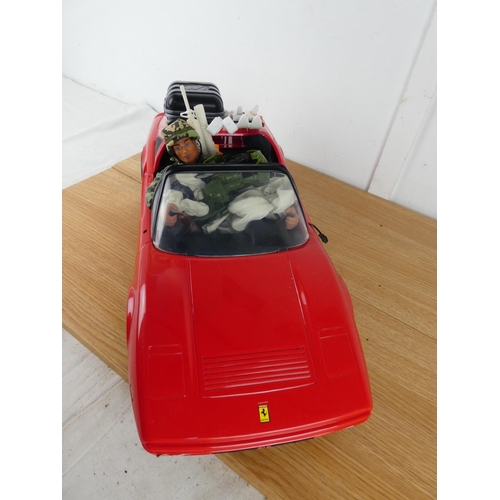 387 - A Ferrari toy car and Action Man figure and more.