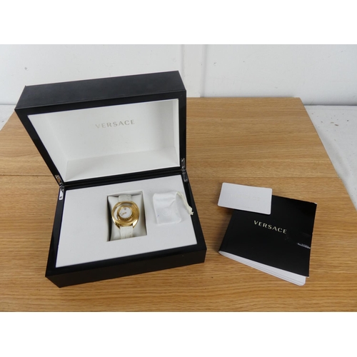 394 - A stunning Versace ladies wrist watch, original receipt and instruction manual in original presentat... 