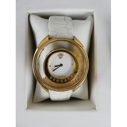 394 - A stunning Versace ladies wrist watch, original receipt and instruction manual in original presentat... 