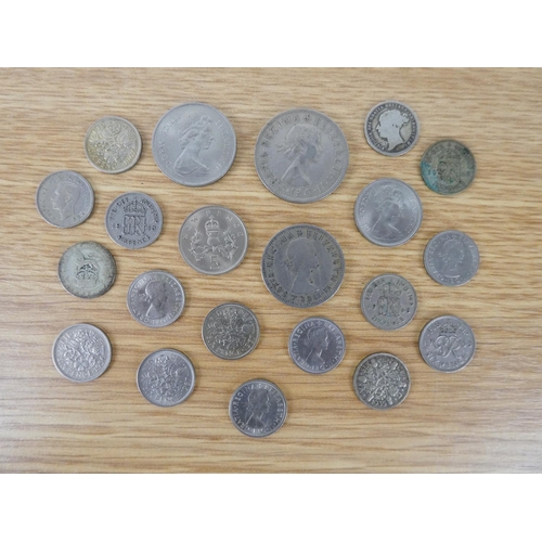 396 - An assorted lot of coinage to include six pence coins, a half crown and more.