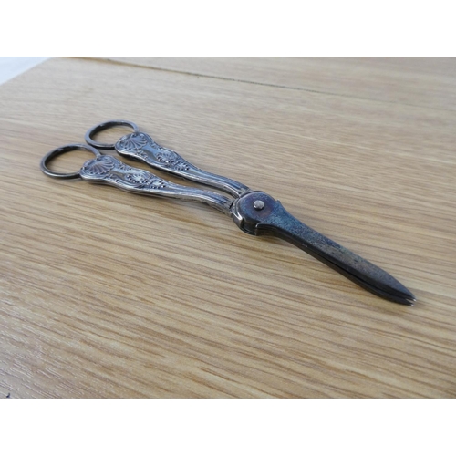 399 - A pair of sterling silver glove stretchers with silver plated handles.