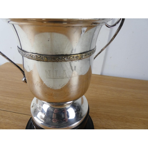 405 - A large silver plated two handled presentation cup.