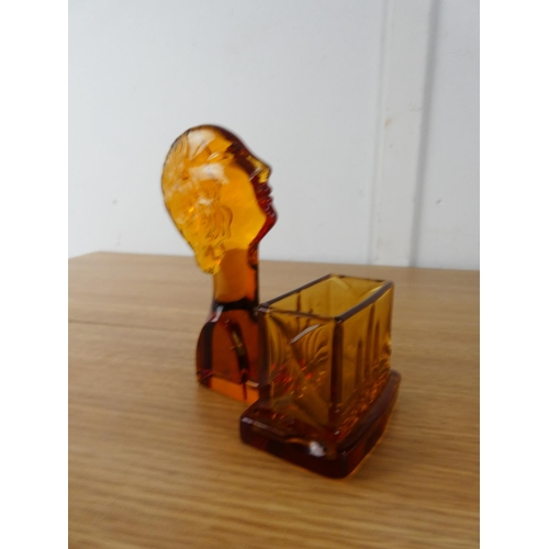 406 - An Art Deco amber glass holder.