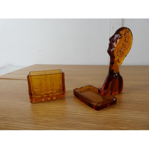 406 - An Art Deco amber glass holder.