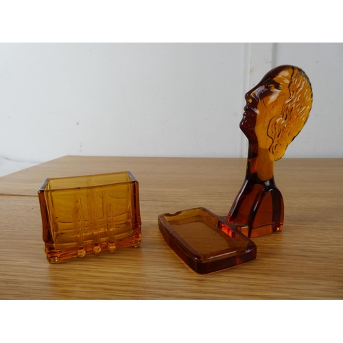 406 - An Art Deco amber glass holder.