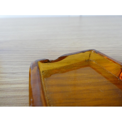 406 - An Art Deco amber glass holder.