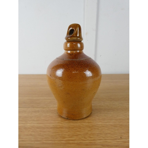 414 - A small stoneware flagon by Doulton Lambeth.