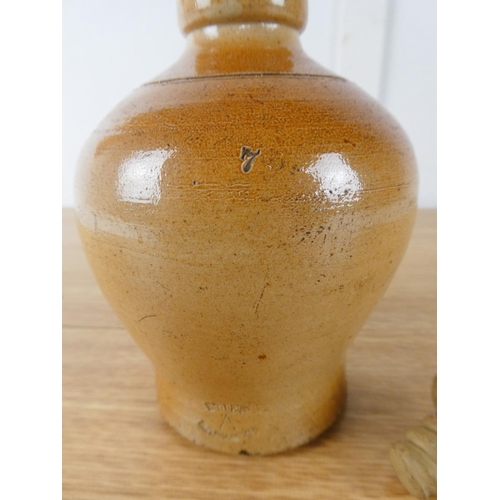 414 - A small stoneware flagon by Doulton Lambeth.