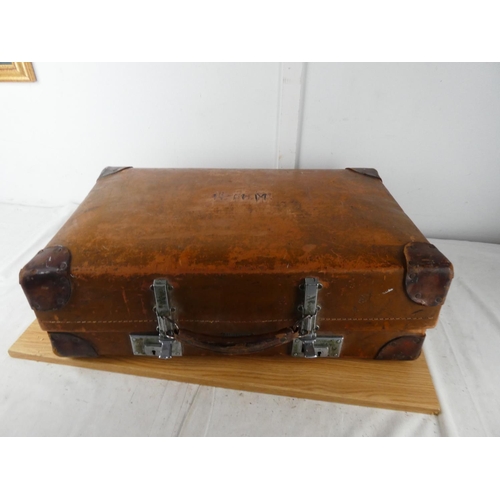 417 - A vintage luggage case containing a lot of child's baby clothes.