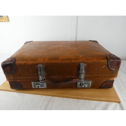 417 - A vintage luggage case containing a lot of child's baby clothes.