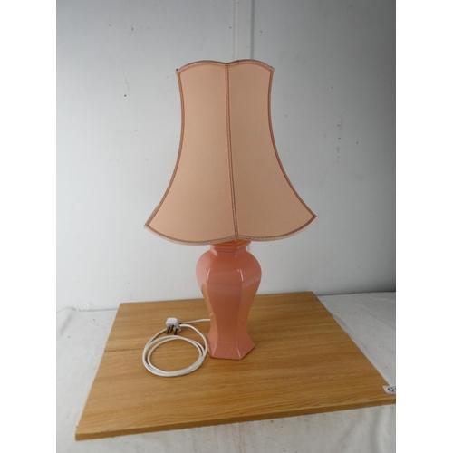 421 - A pink table lamp and shade.