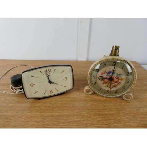 432 - A vintage Smith's mantle clock and another.