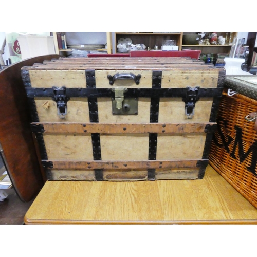 437 - A vintage steamer trunk.