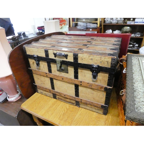 437 - A vintage steamer trunk.