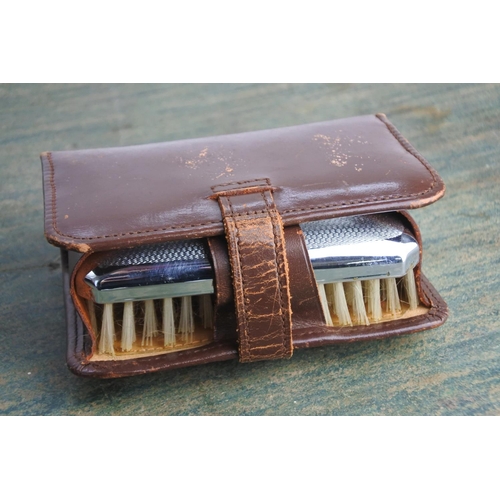 450 - A vintage leather grooming set.