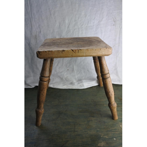 468 - An antique wooden stool.