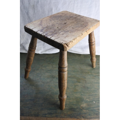 468 - An antique wooden stool.