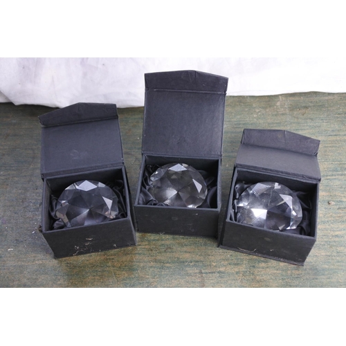 476 - Three boxed paperweights.