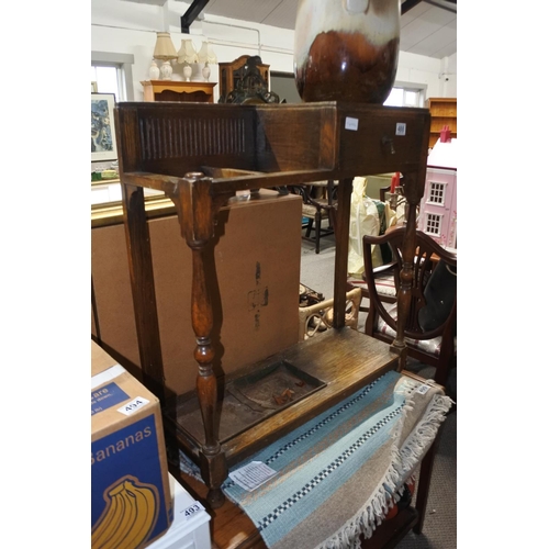 488 - A vintage oak hall stand with original drip trays.