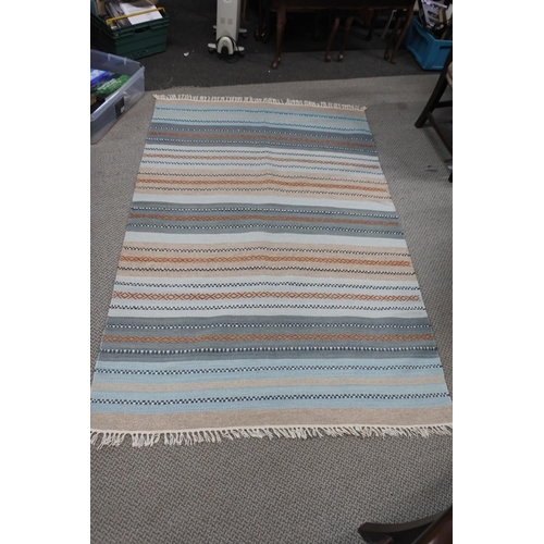 490 - An Indian handwoven rug measuring 4' x 6'.