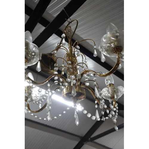 495 - A brass metal and glass chandelier,