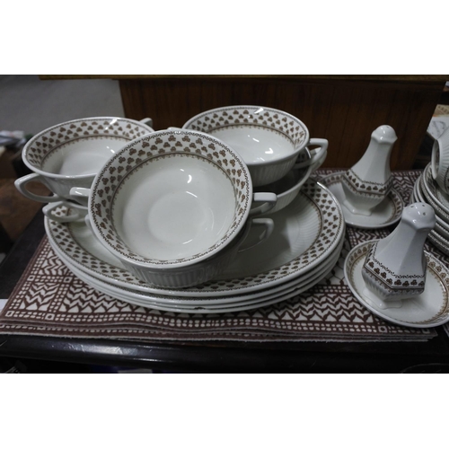 497 - A large set of Adams dinnerware to include place mats.