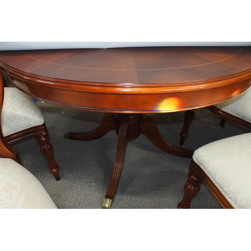 508 - A stunning set of four balloon backed dining room chairs and matching dining room table.