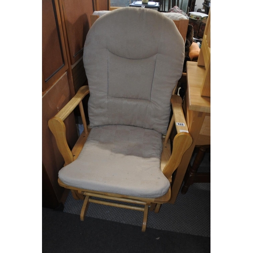 525 - An upholstered rocking chair.