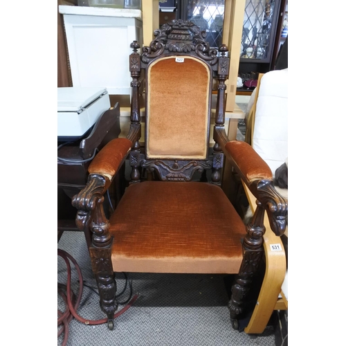 527 - A stunning antique oak framed armchair with highly decorative carved detail.