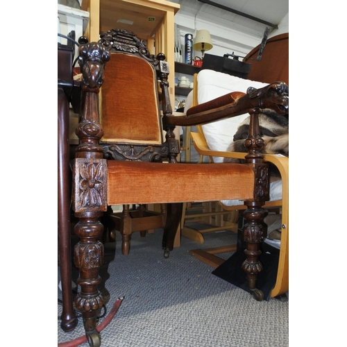 527 - A stunning antique oak framed armchair with highly decorative carved detail.