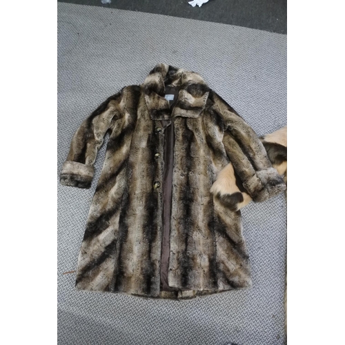 532 - Two faux fur coats.