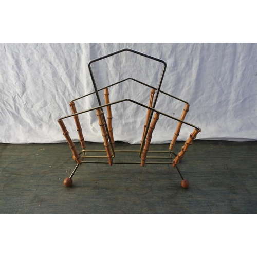 534 - A vintage metal and bamboo magazine rack.