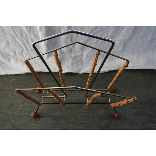 534 - A vintage metal and bamboo magazine rack.