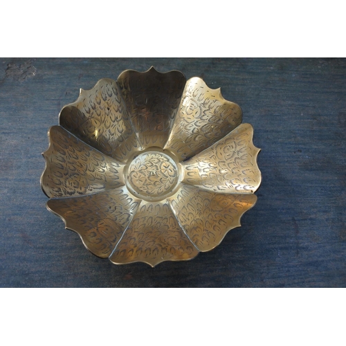 536 - A decorative brass bowl.