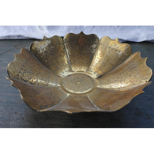 536 - A decorative brass bowl.