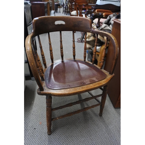 538 - A stunning antique oak smokers fireside chair.