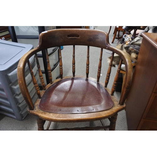 538 - A stunning antique oak smokers fireside chair.