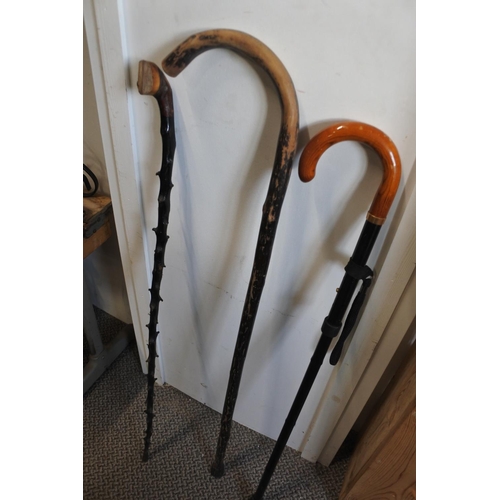 539 - An antique blackthorn walking stick and two others.