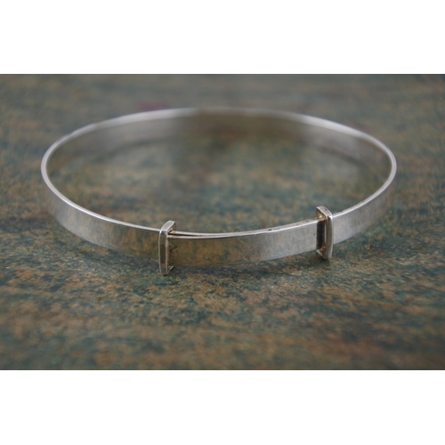 594 - A child's silver identity bangle.