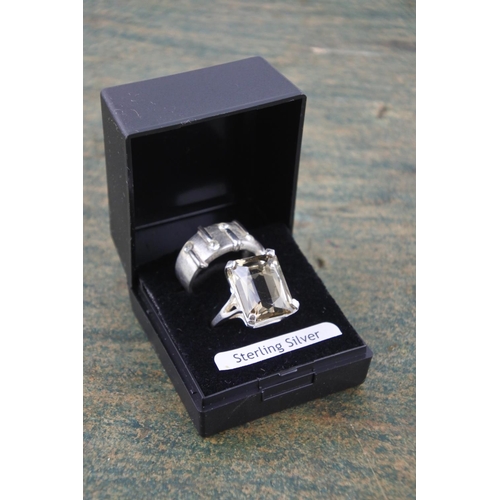 595 - A smokie quartz sterling silver dress ring and another.