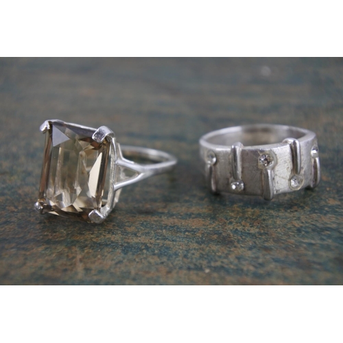 595 - A smokie quartz sterling silver dress ring and another.